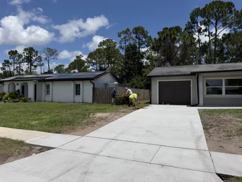 Even green Bahia lawn across the front of the home