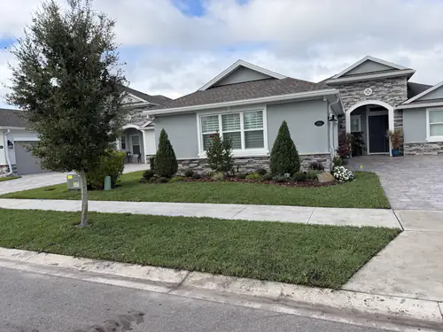 After: Citra Blue sod laid up to the front bed and walkway