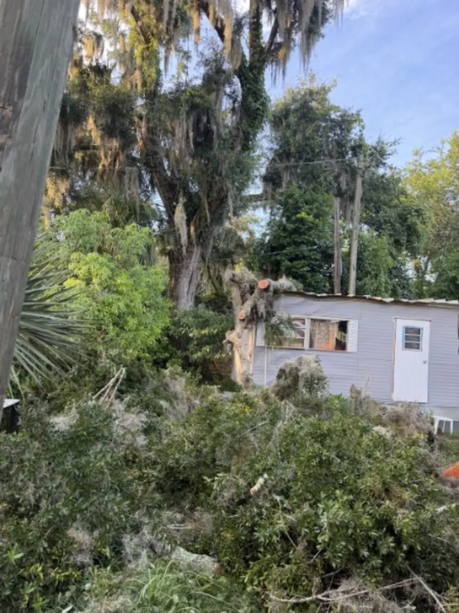 Crew sectioning the fallen oak off the home in Orange City, FL